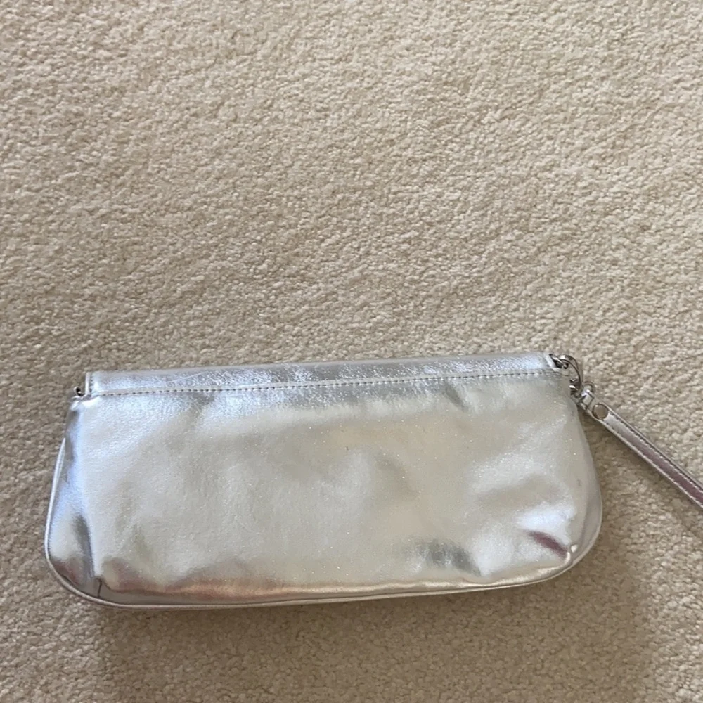 Silver clutch with removable chain and wrist strap